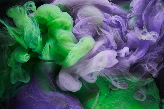 Green purple smoke abstract background acrylic paint underwater explosion