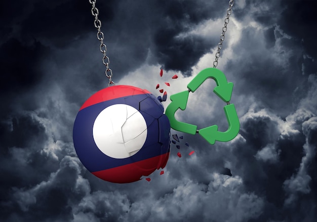 Green recycle symbol crashing into a laos flag ball d\
rendering