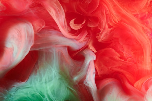 Green red contrast liquid art background paint ink explosion abstract clouds of smoke mockup watercolor underwater