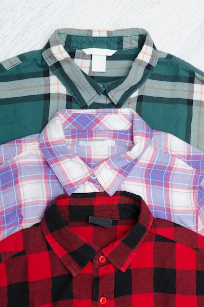 Green, red and lavender plaid shirts. Fashionable concept