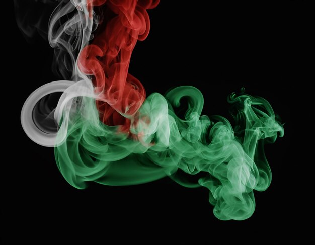 Photo green red smoke on black background generative ai