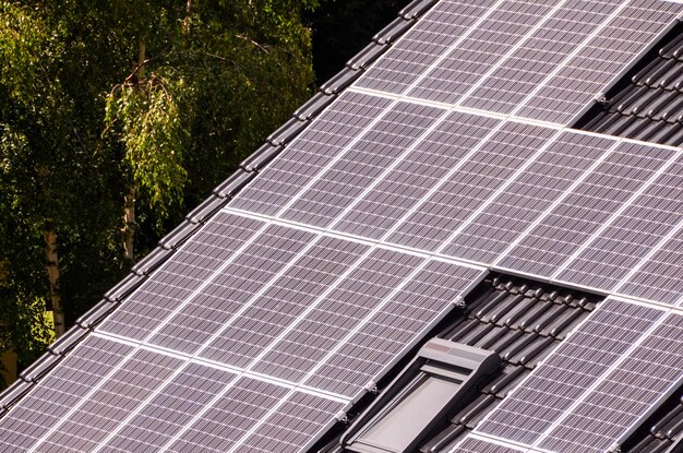 Green Renewable Energy with Photovoltaic Panels on the Roof.