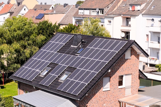 Green Renewable Energy with Photovoltaic Panels on the Roof.