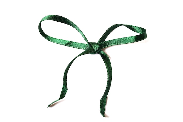 Green ribbon bow isolated on white background