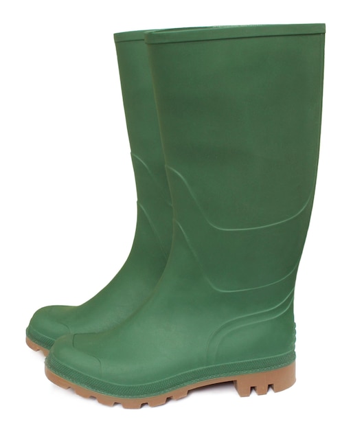 Green rubber boot over white background