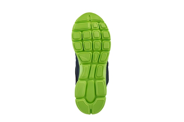 Photo green rubber sole with sneakers on a white background