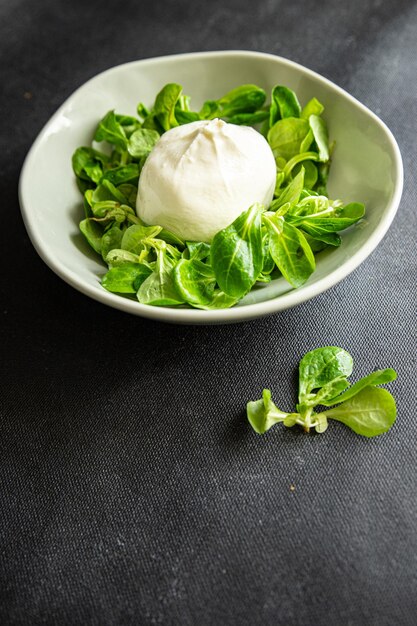 green salad buratta leaves mix fresh healthy meal food snack on the table copy space food