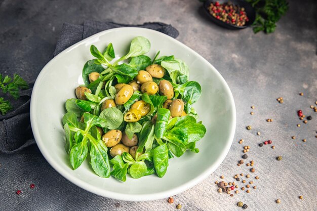 green salad olive, leaf lettuce, mache corn lettuce fresh healthy meal food snack diet on the table