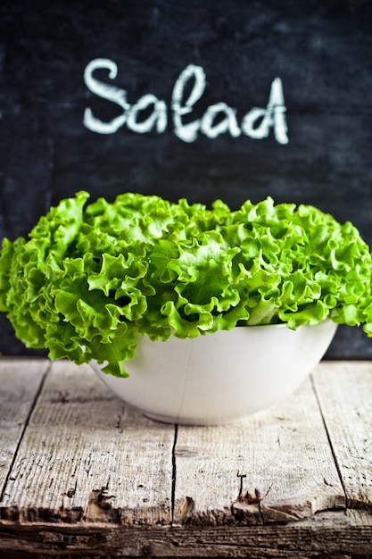 Green salad on white bowl