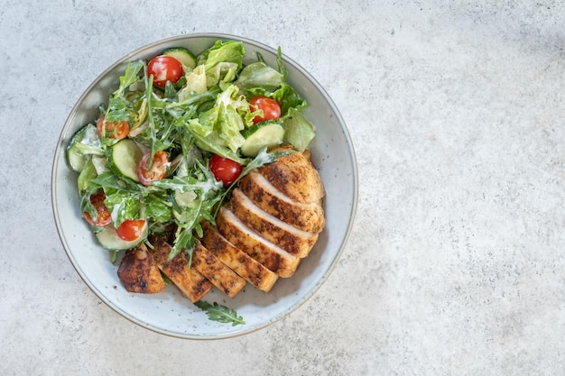 Green salad with grilled chicken breast