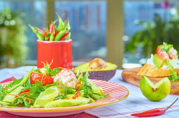 Green salad with shrimps and poached egg