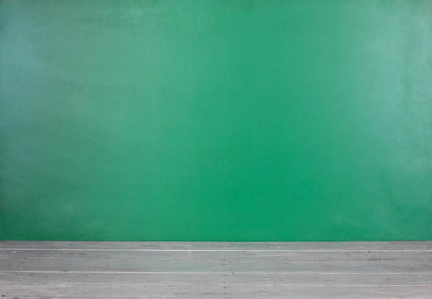 green school board and white wooden table