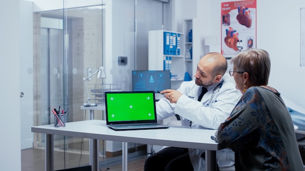 Green screen consultation at doctor in modern privat clinic. Mockup mock-up isolated background ready to be removed chroma key keying for your app or advertisement