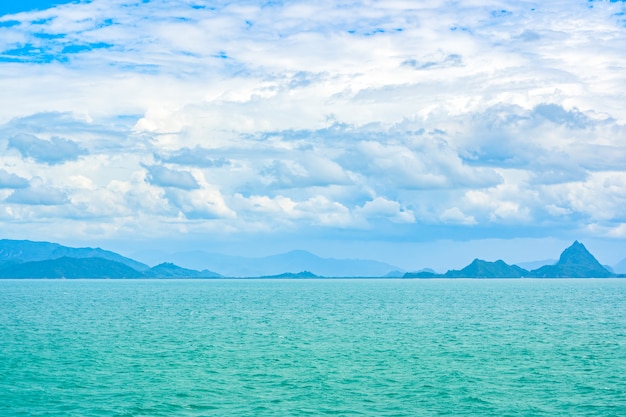 Green sea and blue cloudy sky