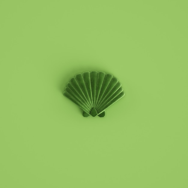 Photo green seashell sculpture on pastel green background