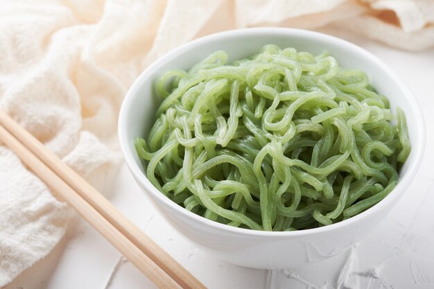 Green shirataki noodle konjac in bowl background. japanese\
food