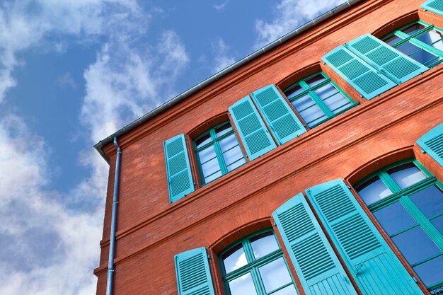 Green shutters and bricks