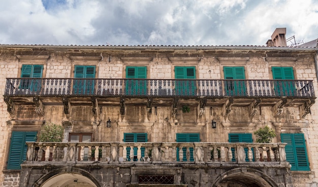 Green shutters on house in streets of old town Kotor in Montenegro