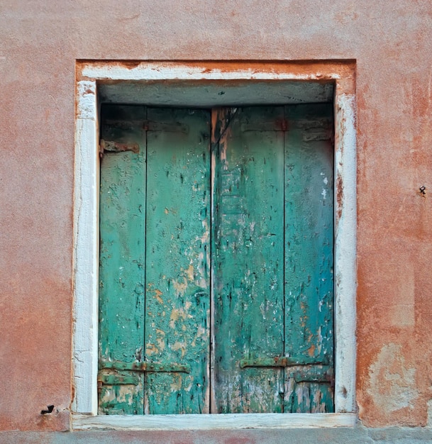 Green shutters in a red wall