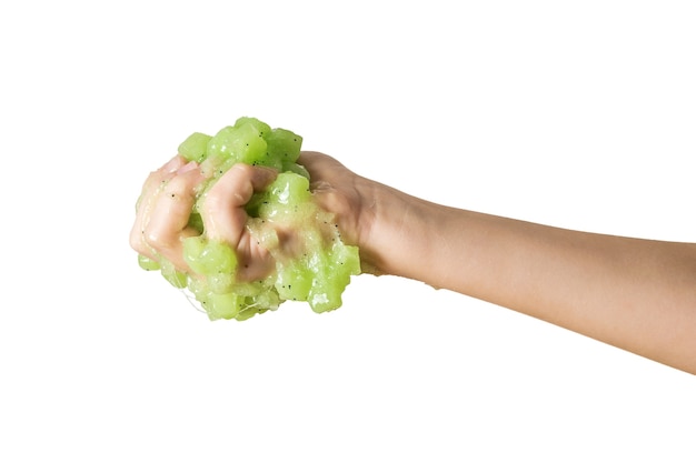 Green slime crushed in the right hand isolated on a white background. Popular children's game.