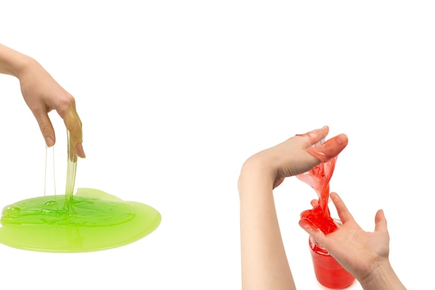 Green slime toy in woman hand isolated on white background