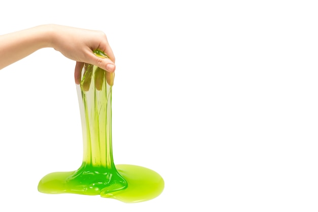 Green slime toy in woman hand isolated on white.