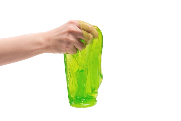 Green slime toy in woman hand isolated on white