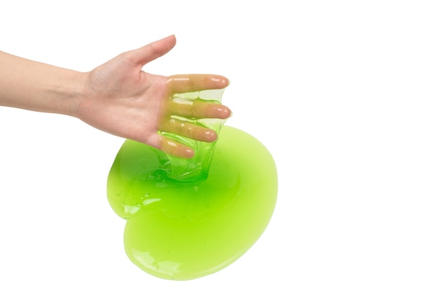 Green slime toy in woman hand isolated on white