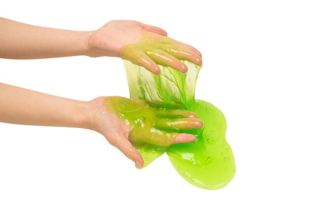 Green slime toy in woman hand