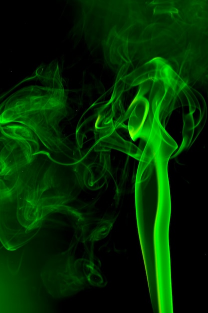 Green smoke on black background