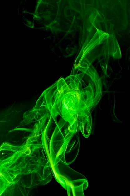 Green smoke on black background