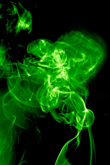 Green smoke on black background