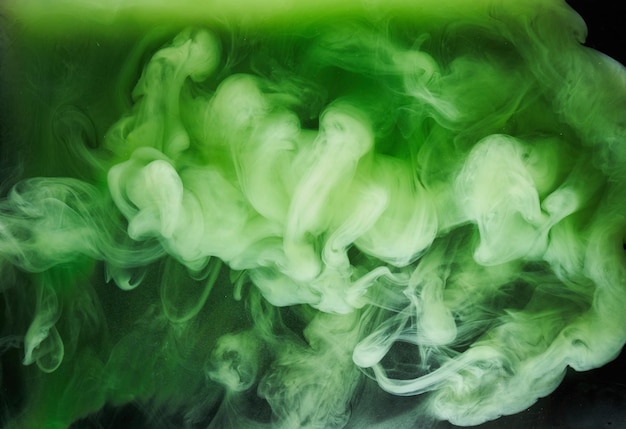 Photo green smoke on black ink background, colorful fog, abstract swirling emerald ocean sea, acrylic paint pigment underwater