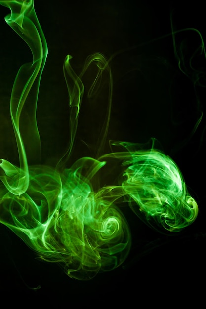 Green smoke motion on black background