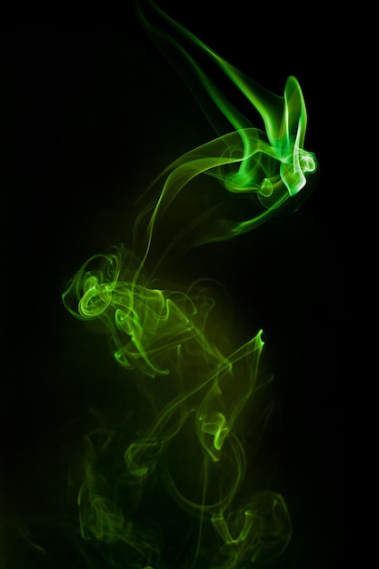 Green smoke motion on black background