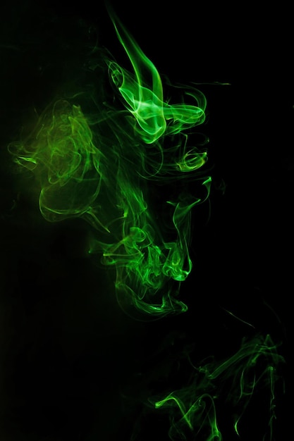 Green smoke motion on black background