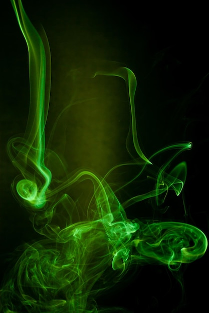 Premium Photo | Green smoke motion on black background