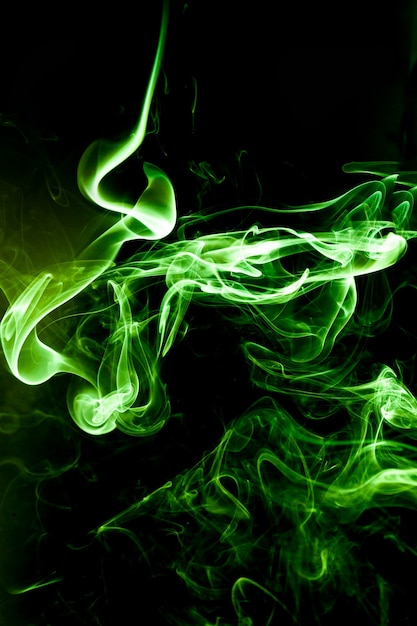 Green smoke motion on black background.