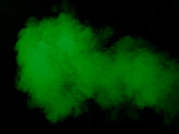 Green smoke texture on black background