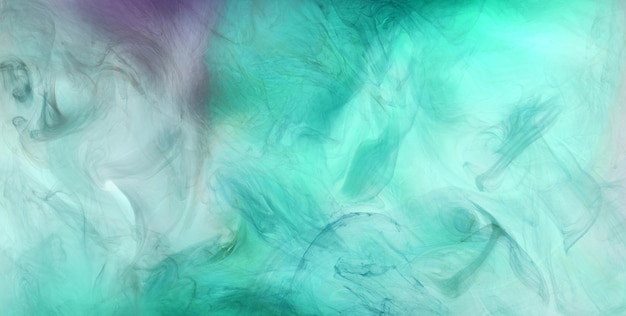 Green smoke on white ink background colorful fog abstract swirling emerald ocean sea acrylic paint pigment underwater