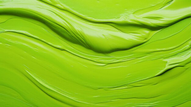 Green smooth paint texture closeup swirl abstract background