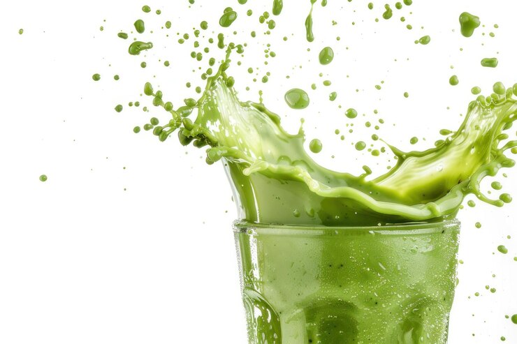 Green smoothie with splashes isolated on white background