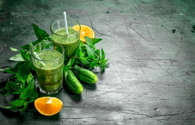 Green smoothie with vegetables, fruits and mint.