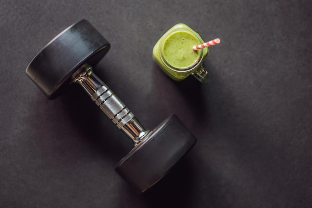 Green smoothies and dumbbells in the gym