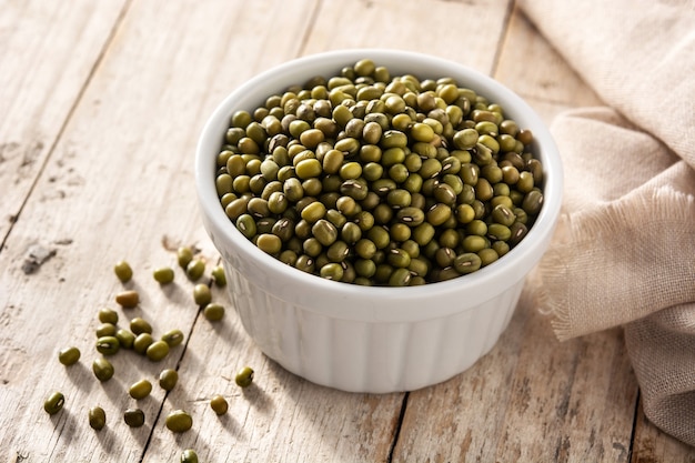 Green soy beans on wooden table.