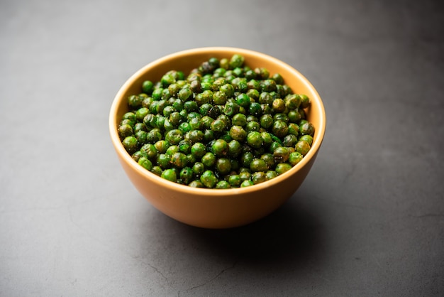 Green spicy peas fried or roasted namkeen, dry snacks or chakna consumed with cocktail drinks in India