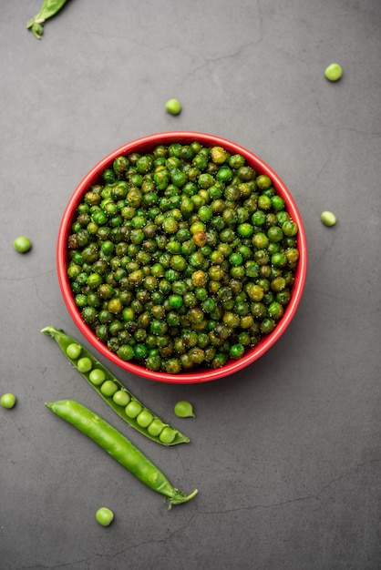 Green spicy peas fried or roasted namkeen, dry snacks or chakna consumed with cocktail drinks in India