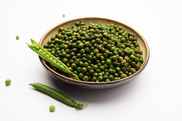 Green spicy peas fried or roasted namkeen, dry snacks or chakna consumed with cocktail drinks in India