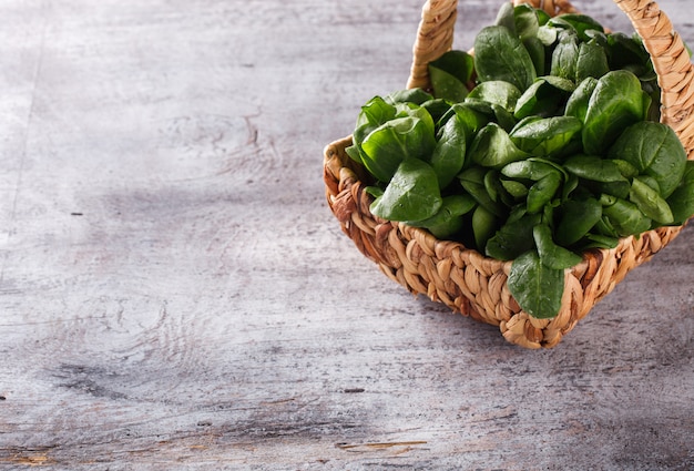 Green spinach in the basket. Healthy food