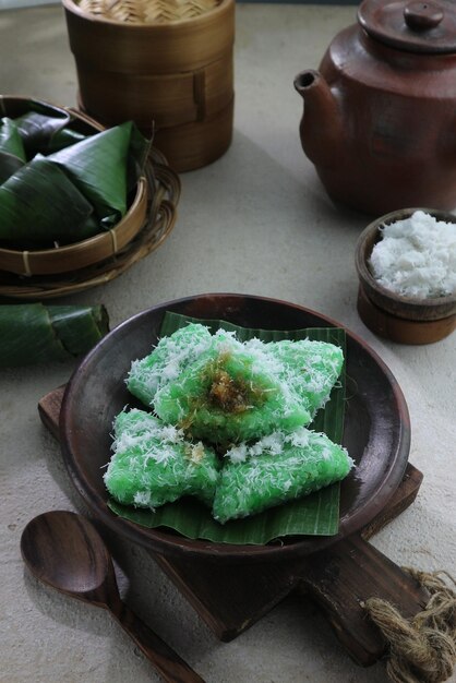 Green sticky rice with banana leaf on a plate